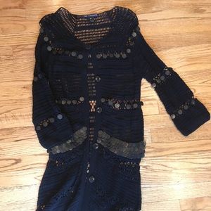 Crochet cardigan with beaded details.